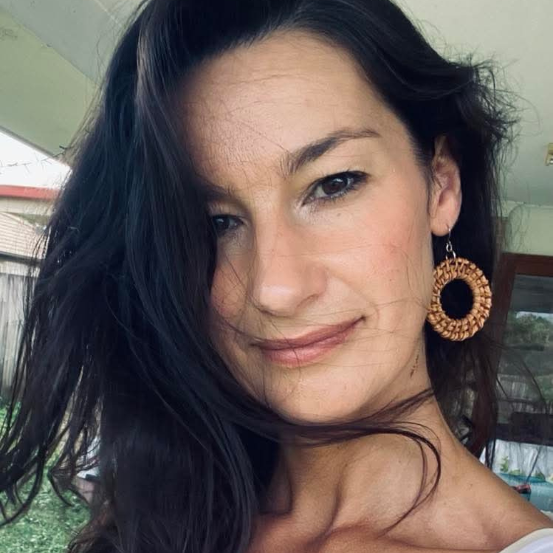 Anika, founder of SoulShine, smiling warmly—your guide through a 7-step transformation to manifest your dream life.